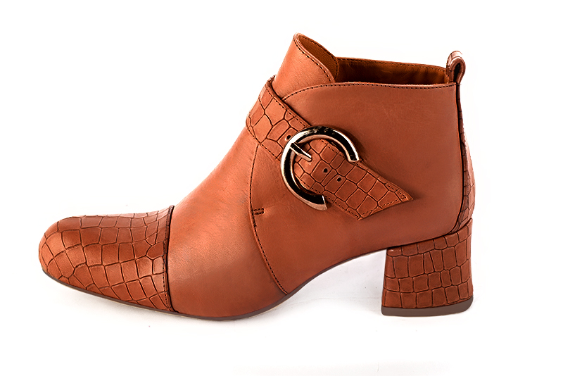 Terracotta orange women's ankle boots with buckles at the front. Round toe. Low flare heels. Profile view - Florence KOOIJMAN